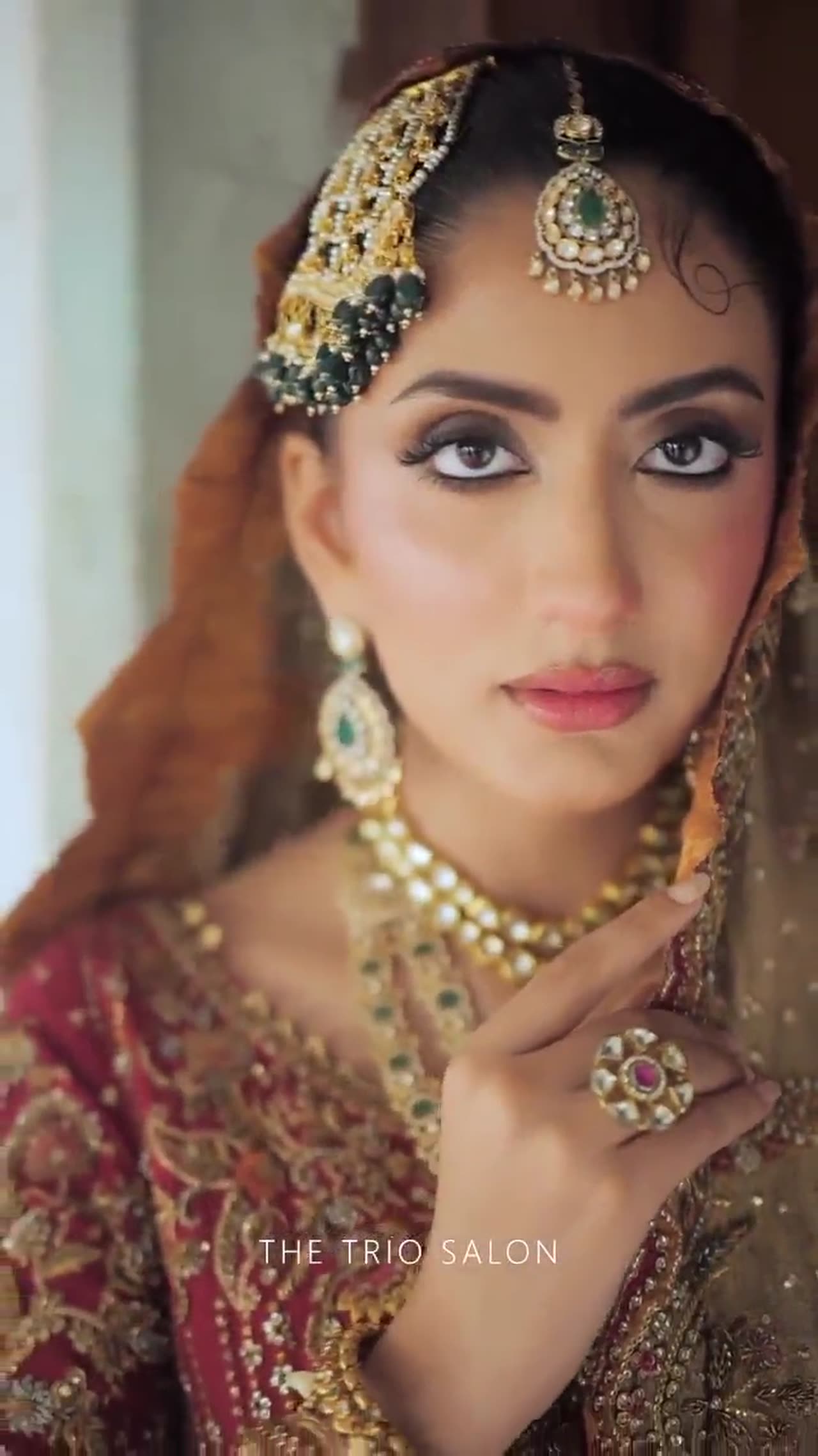 Draped in timeless red, regal and radiant.